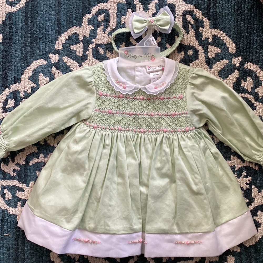 Like new!  Beautiful Smocked dress and diaper cover!  Size 9 months.